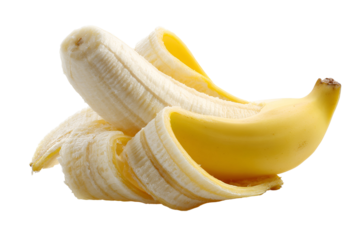 A ripe yellow banana partially peeled against a stark black background