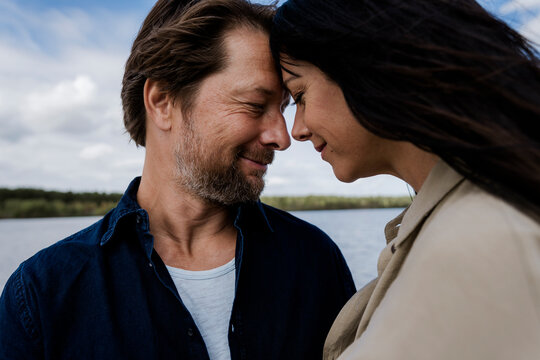 Couple embracing outdoors showing love and connection on windy day