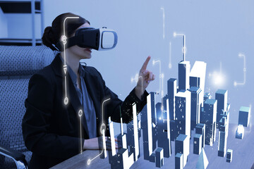 Woman using virtual reality headset in office. Hologram of buildings in front of him. Modern technologies in architecture