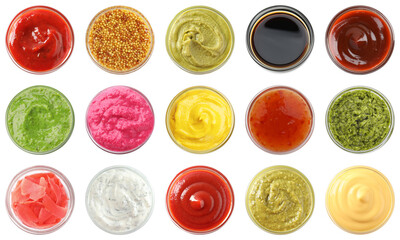 Different condiments isolated in bowls on white, set. Top view