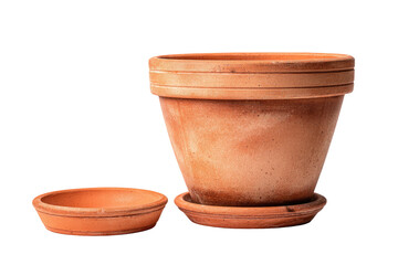 Two terracotta plant pots and a saucer on a dark background