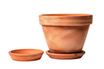 Two terracotta plant pots and a saucer on a dark background