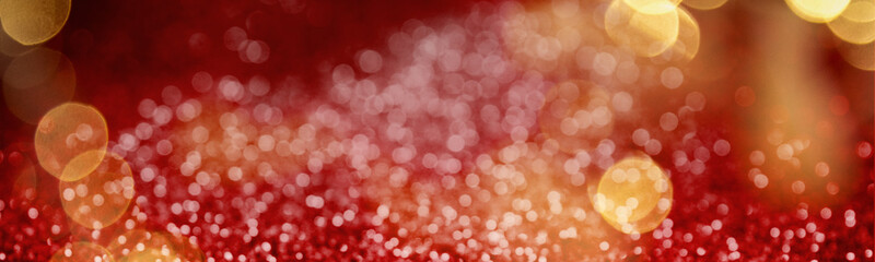 Christmas background with red glitters and bokeh lights. Banner design