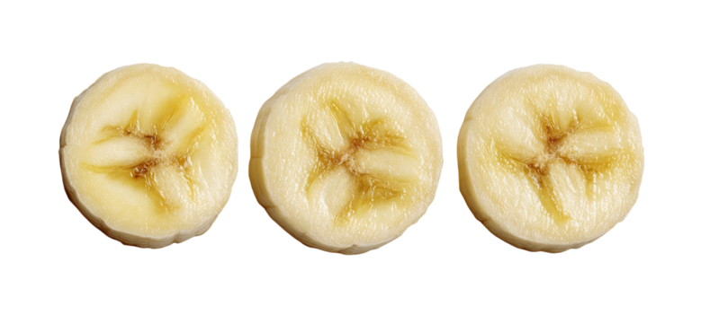 Three perfectly sliced banana rounds on black background