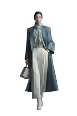 Fototapeta premium Stylish Silhouette: A poised model strides confidently, draped in elegant, flowing garments that exude sophistication and grace. Capture the allure of high fashion and refined taste.