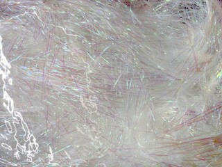 Abstract texture of iridescent threads in muted silver tones, shimmering background for modern packaging or digital design