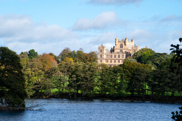 A beautiful landscape with trees in autumn color at the Wollaton Country and Deer Park in Nottingham, UK.