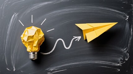 A yellow origami light bulb and paper airplane on a chalkboard, symbolizing innovation turning ideas into action.