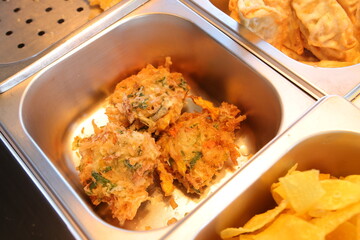 Delicious crispy fried fritters with a delightful golden-brown hue, ready to be served and enjoyed