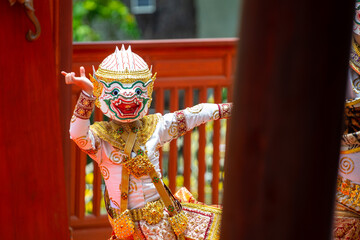 A child performer wearing a Hanuman mask in a traditional Thai Khon dance. The costume is decorated with gold embroidery, showing the beauty of Thailand's classical performing arts.