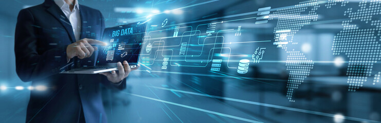 Data analyst using laptop analyzing and development big data platform. Massive dataset processing...