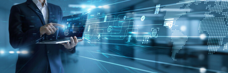 Cyber expert using laptop analyzing and development mobile security systems. Protecting devices from threats, encryption, authentication, privacy control, and secure connectivity.