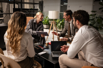 Business people collaborating during informal office meeting