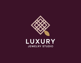 A sophisticated logo representing a luxury jewelry studio, featuring an intricate design symbolizing elegance and craftsmanship, appealing to high-end clientele.