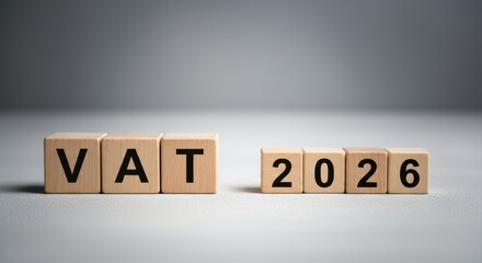 Obraz premium Grey Wooden Cube with Tax & VAT Symbol Conceptual Business Imagery, Perfect for Corporate Websites and Presentations.