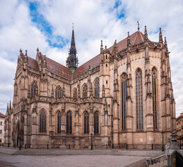 Fototapeta premium Gothic St. Elizabeth Cathedral in Košice, Slovakia, viewed from the square. Historic landmark with ornate stone details and colorful tiled roof.