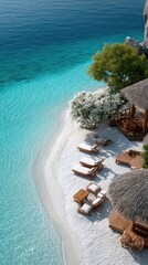 Top Down View Of Sun Loungers And Umbrellas Arranged On A White Pebble Beach Beside Turquoise Ocean Water On A Sunny Day