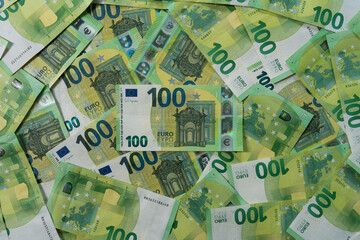 Full frame top down view of multiple 100 Euro banknotes filling the entire frame representing abundance finance and currency
