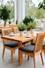 Fototapeta premium Modern cafe interior with plants and empty tables