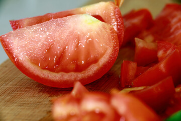 Bright close-up image of fresh cherry tomatoes on the vine with vibrant green leaves. Perfect for themes of healthy food, gardening, freshness, and cooking