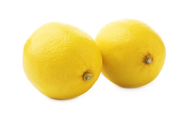 Two whole ripe lemons isolated on white