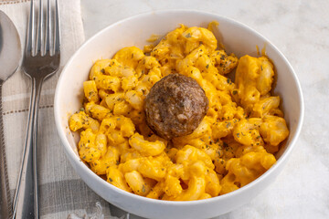 macaroni and cheese  with an italoan style meatball
