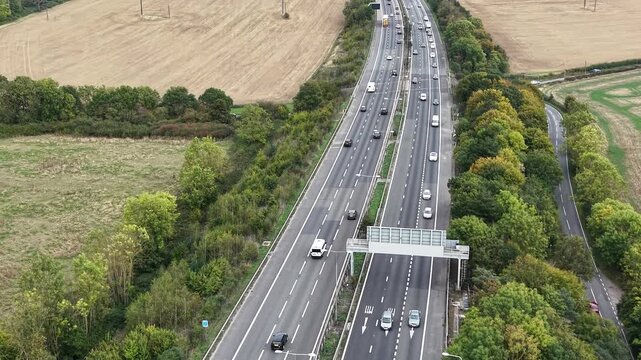 Traffic on M11 motorway Essex UK Overhead birds eye drone aerial view
