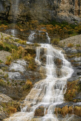 Picturesque high mountain waterfall in the Sopeliana ravine in Bujaruelo
