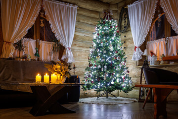 Cozy Christmas tree and candles in rustic wooden cabin