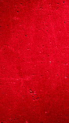 wall painted with red paint with an interesting texture