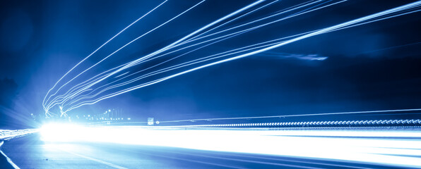 blue car lights at night. long exposure
