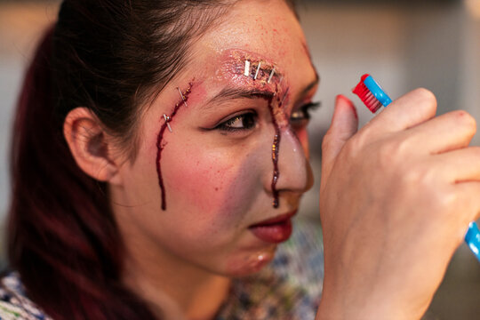 Closeup of creative Halloween SFX makeup texture on female face