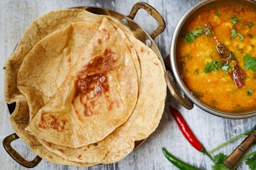 Homemade roti or Chapati served with dal tadka | lentil curry