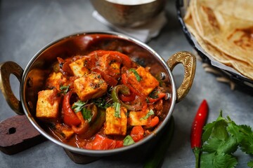 Homemade Paneer Jalfrezi served with fresh roti or Chapati, selective focus
