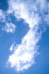 Bright Blue Sky with Wispy White Clouds on a Sunny Day.