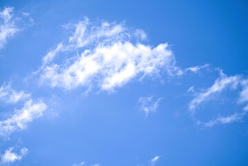 Bright Blue Sky with Fluffy White Clouds on a Sunny Day.