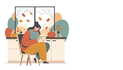 Woman using tablet at home in cozy autumnal setting with pumpkins and falling leaves