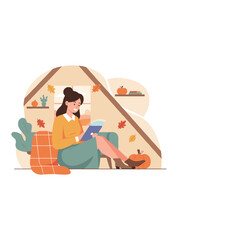 Cozy woman using tablet in a fall attic room Remote work reading or leisure