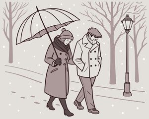 Couple walking in winter under umbrella