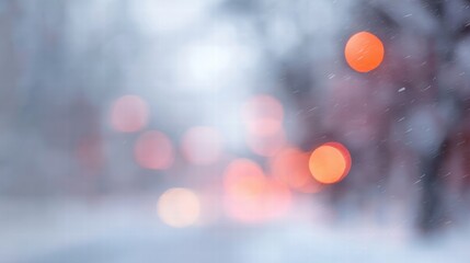 Blurred winter wonderland background with sparkling snow and glowing lights.