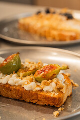 Vegetarian toast with figs ricotta and walnuts for breakfast