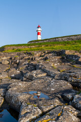 vertical view of the Torshavn Lighthouse at the Skansin Fortress on the Faeroe Islands at sunrise