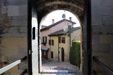 Cobbled street at the entrance of Scaligeri Castle, Malcesine, Italy