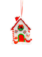 Colorful house ornament with Santa, candy details, and snow roof. Perfect for Christmas decor and holiday themes