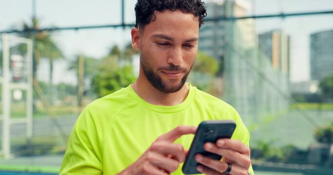 Fitness, typing and man on court with phone, funny message or exercise post on social media. Smile, digital and athlete outdoor with mobile, wellness chat or virtual tutorial on training break.
