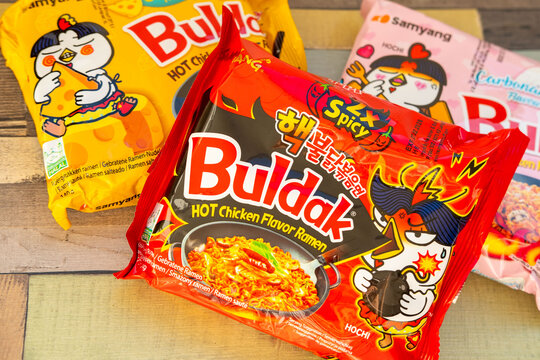 Korean instant ramen, Popular spicy noodle brand Buldak in spicy, cheese and carbonara flavors, global trend popular food product, snack sensation selection, fiery and creamy varieties