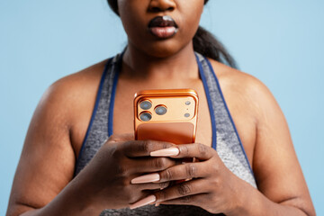 Plus size woman holding smartphone