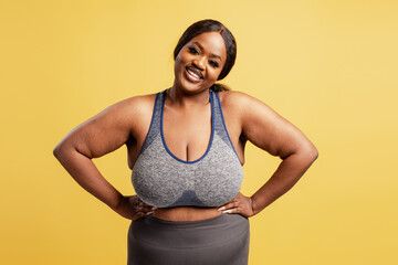 Black plus size woman smiling representing body positivity