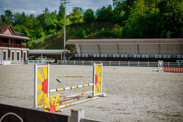 empty show jumping arena with obstacles, barriers and poles, horse riding, equestrian sport and horses concept, competition field, background wallpaper 