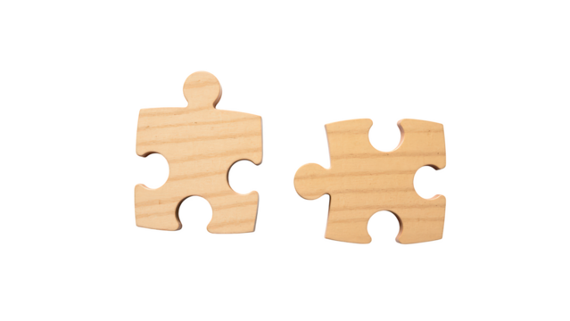 Two wooden puzzle pieces, light colored, interlocking design, symbolizing connection and problem solving